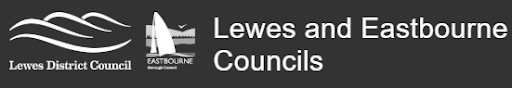 Logo of Lewes District and Eastbourne Councils, design with stylised waves and a sailboat design on a dark background.