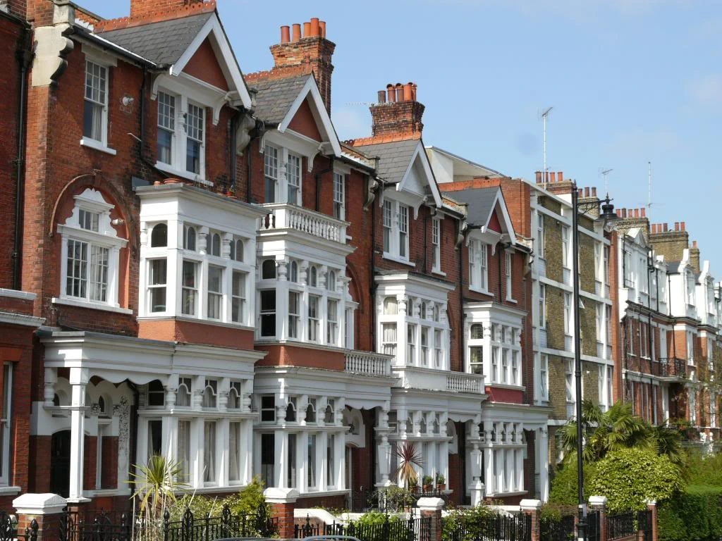 Victorian-style townhouses with elaborative facades , showcasing intricate details and stunning architecture.
